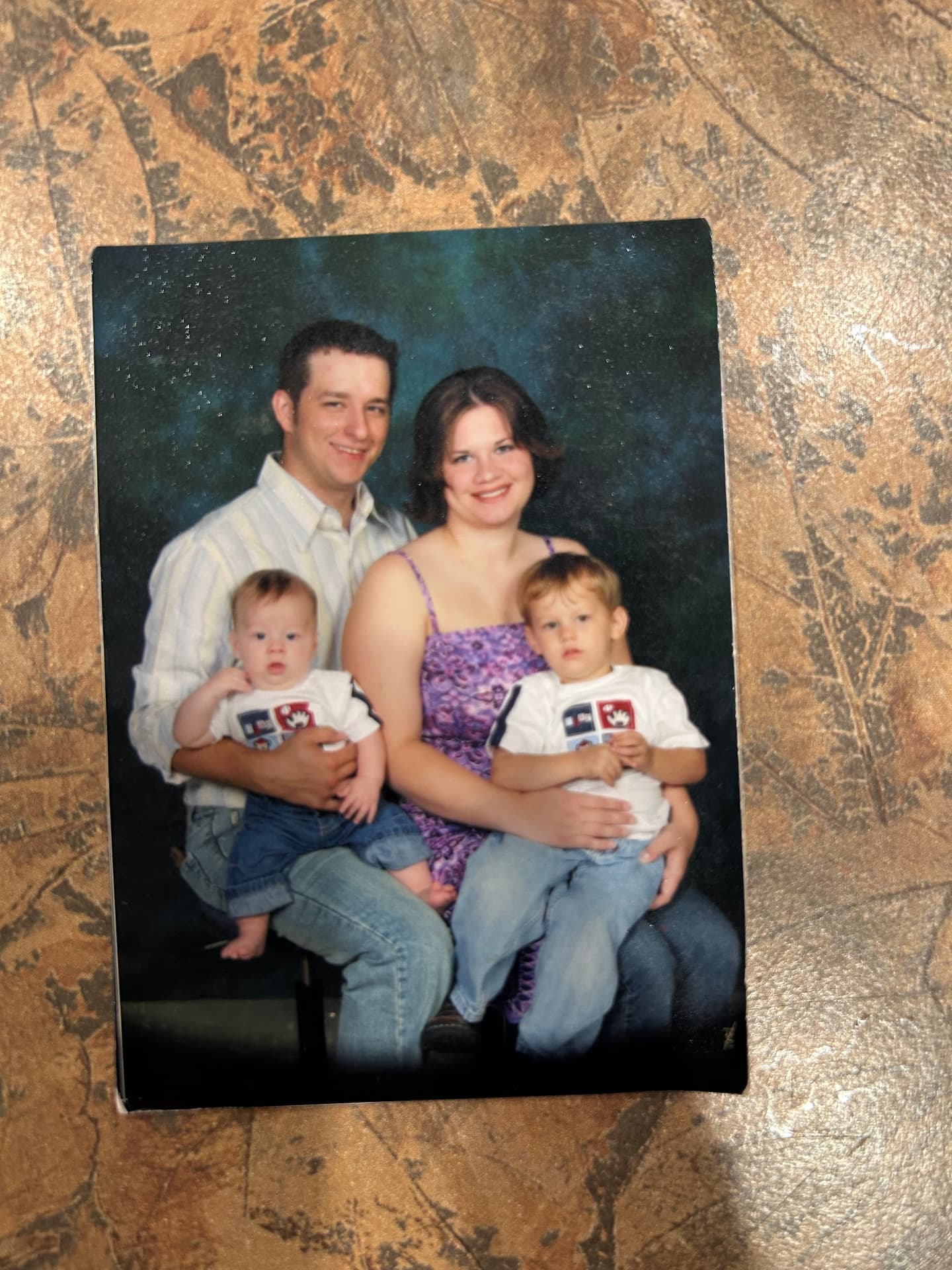 Nick and his wife with their first two boys