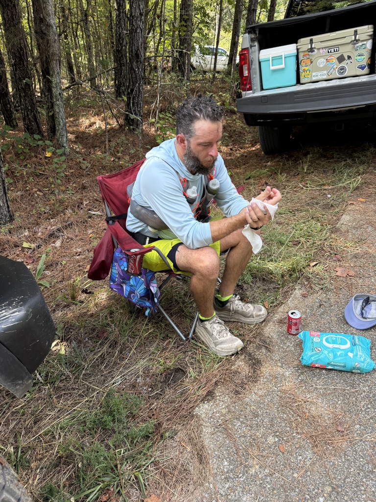 Nick resting at an aid station during the 50-mile ultra